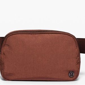 Copper/brown lulu lemon cross body bag.